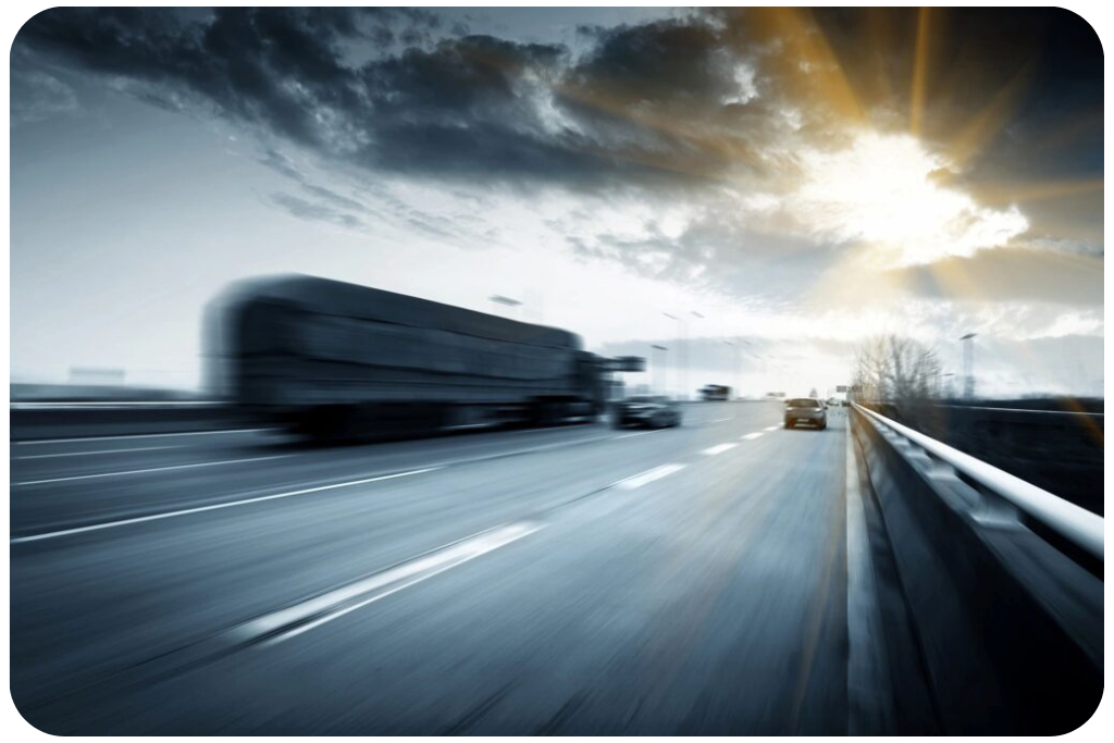 Safe equitable movement section image of tractor trailer traveling down a highway with various vehicles - Department of Transportation